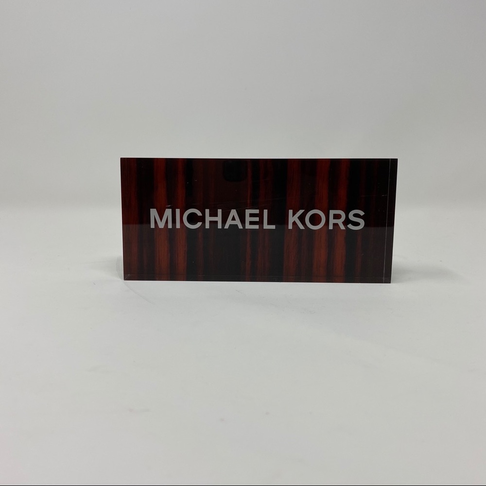 Michael Kors plaque
